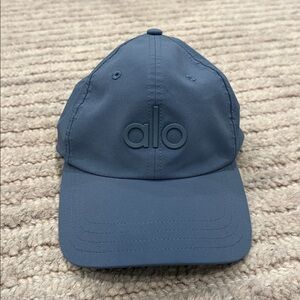 Alo Yoga performance district trucker hat